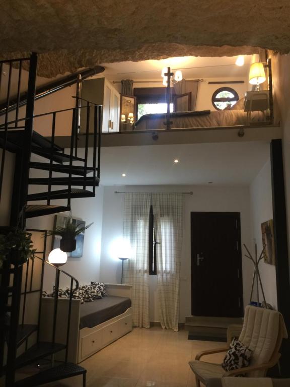 Postel nebo postele na pokoji v ubytování Casa Cueva Un Rincón en la Roca