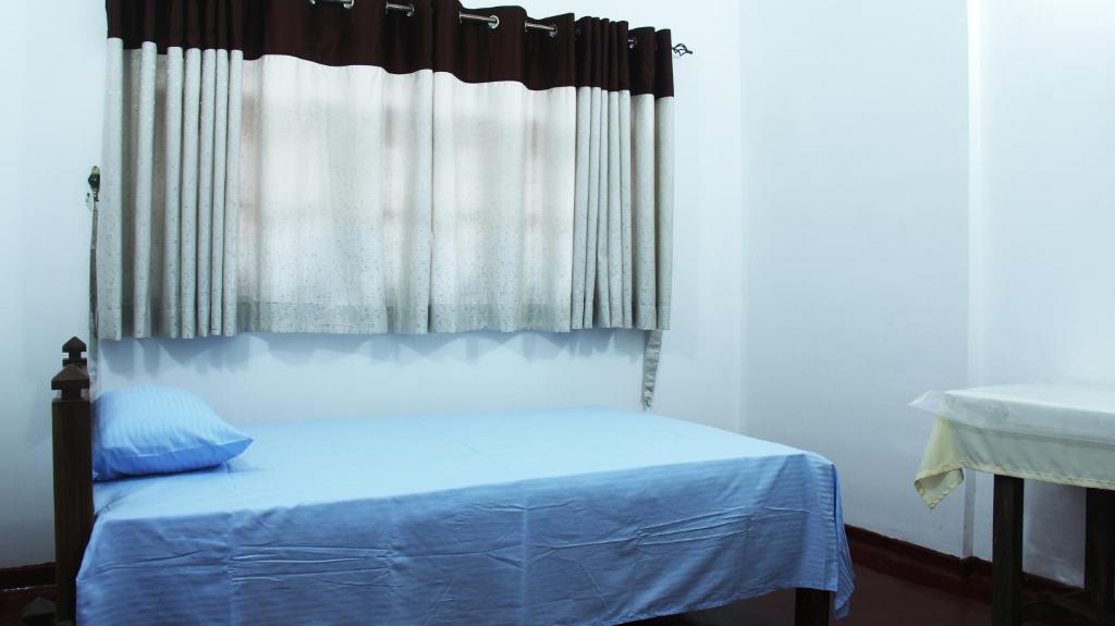Postel nebo postele na pokoji v ubytování Grand Villa