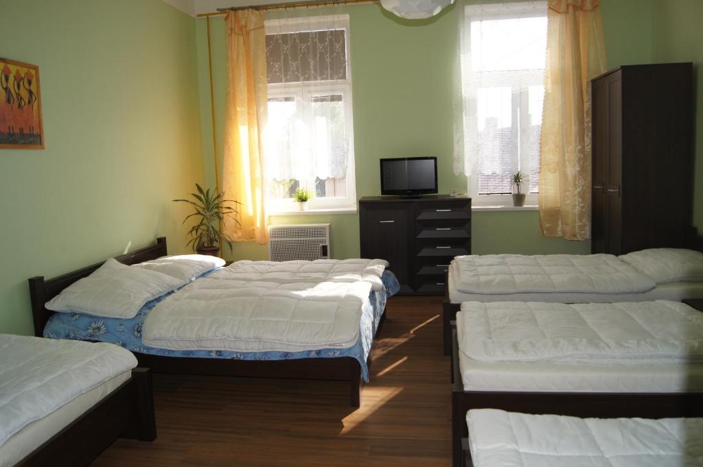 Postel nebo postele na pokoji v ubytování Penzion Modrý Jelen