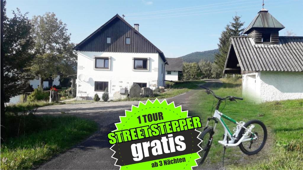 a bike parked in front of a house at Böhmerwald Angerholz in Ulrichsberg