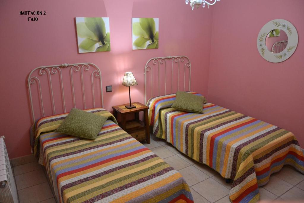 Cama o camas de una habitación en Apartamentos Rurales Natura