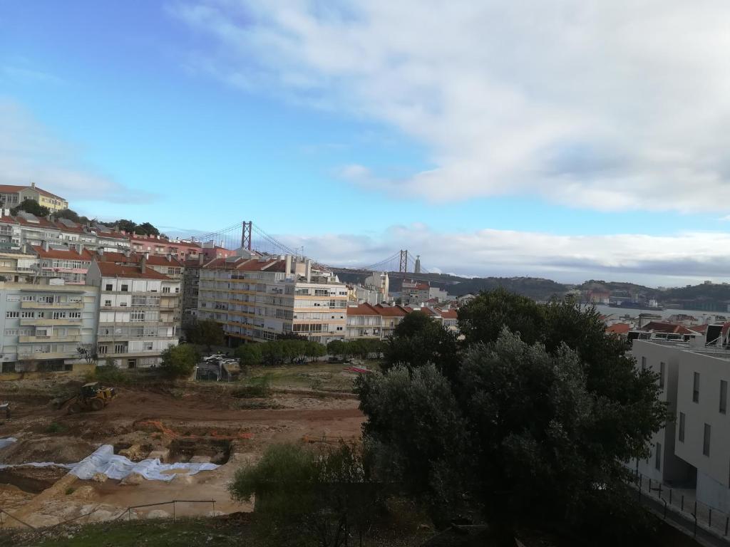 a view of a city with buildings at The Tram 18 Space in Lisbon
