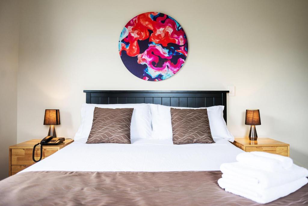 Postel nebo postele na pokoji v ubytování 123 Motel