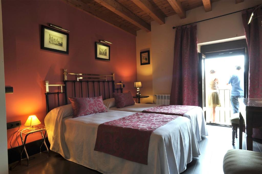 Postel nebo postele na pokoji v ubytování Hotel-Hospedería los Templarios