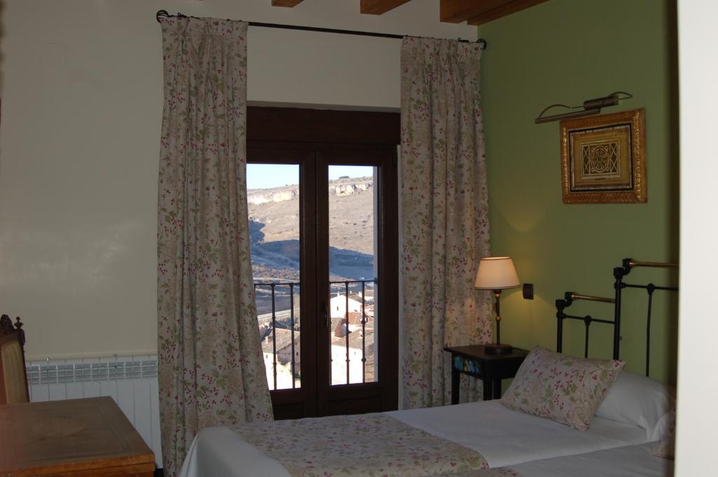 Postel nebo postele na pokoji v ubytování Hotel-Hospedería los Templarios