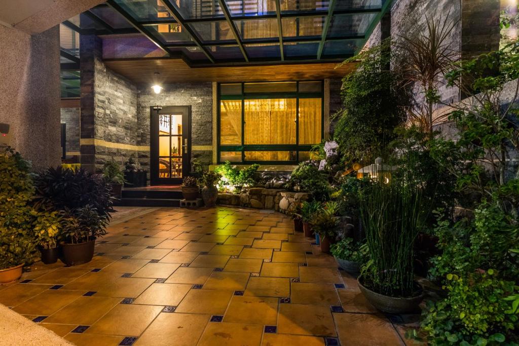 an indoor garden with plants in a building at Qing Jing Ze Bed &amp; Breakfast in Hualien City
