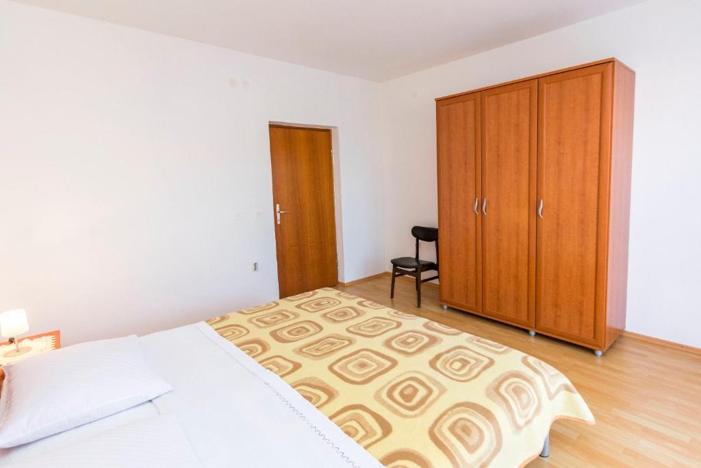 Cama o camas de una habitaci&oacute;n en Apartments Matejka I