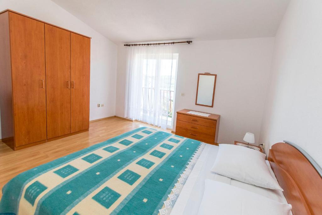 Postel nebo postele na pokoji v ubytování Apartments Matejka