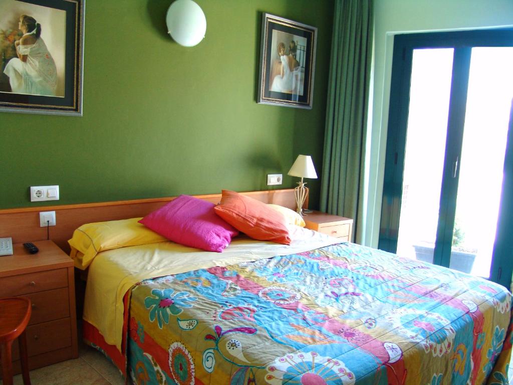 Postel nebo postele na pokoji v ubytování Hotel Pinxo