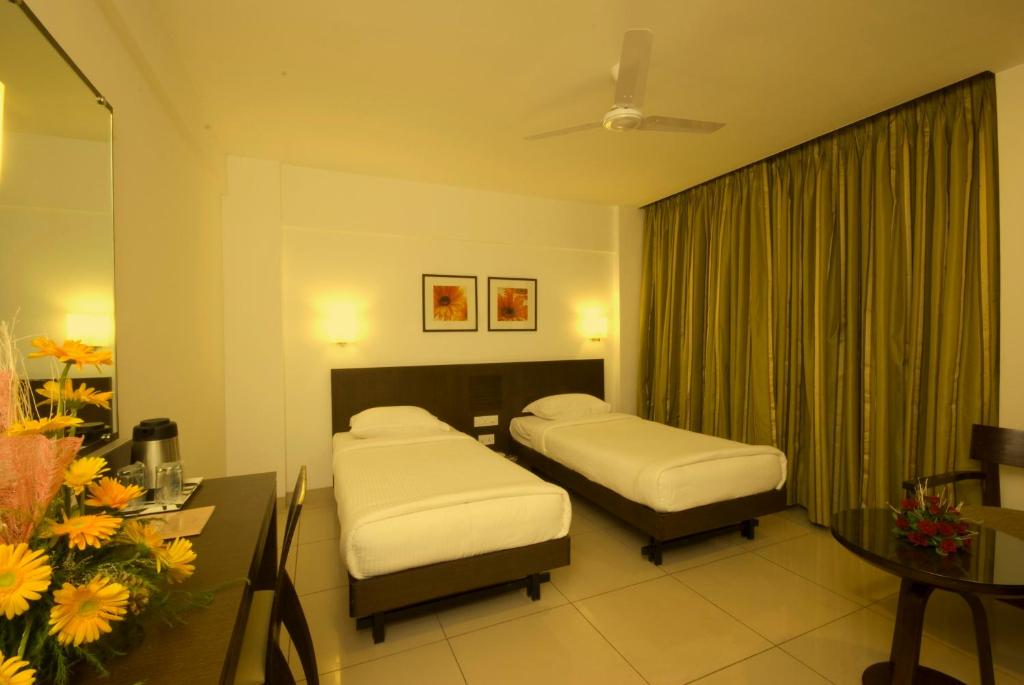 Voodi või voodid majutusasutuse Shantai Hotel toas