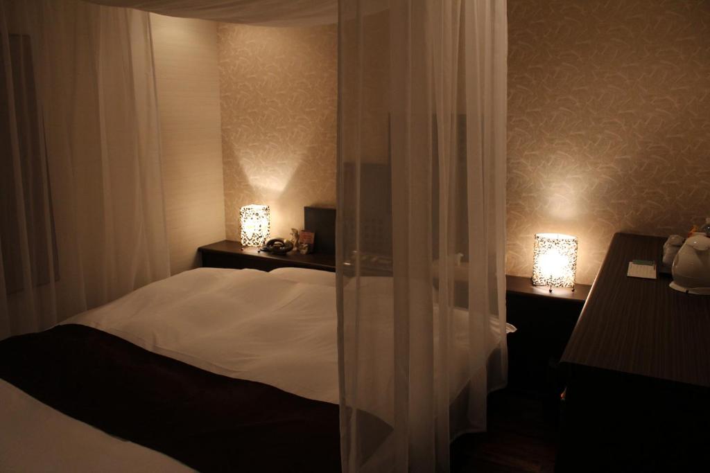 Postel nebo postele na pokoji v ubytování Hida Takayama Hotel Viera Resort (Adult Only)