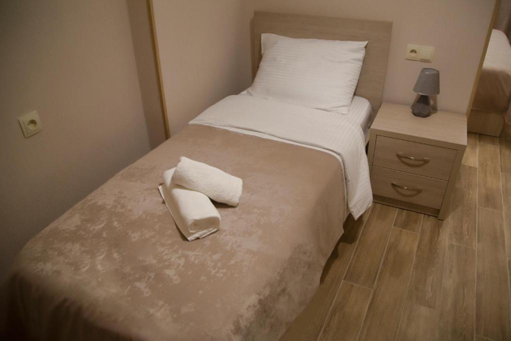 Postel nebo postele na pokoji v ubytování Family Hotel Triston