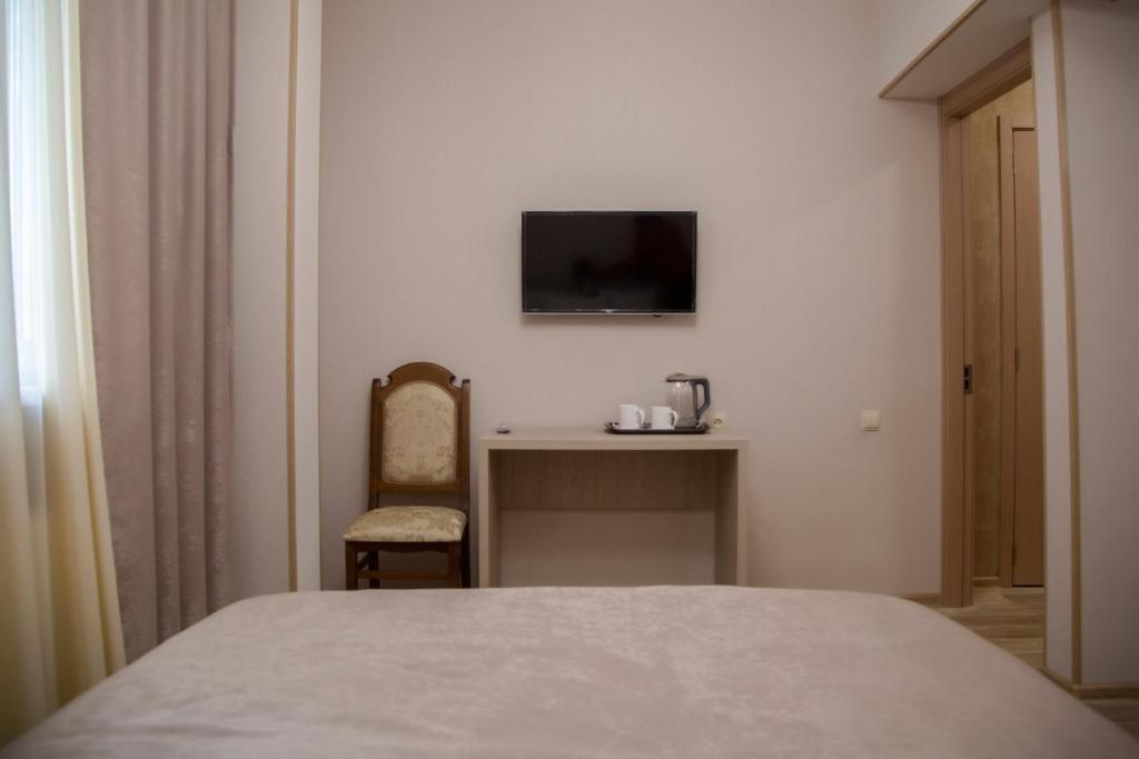 Postel nebo postele na pokoji v ubytování Family Hotel Triston