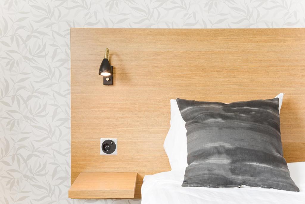 Postel nebo postele na pokoji v ubytování Hotel Spekeröd