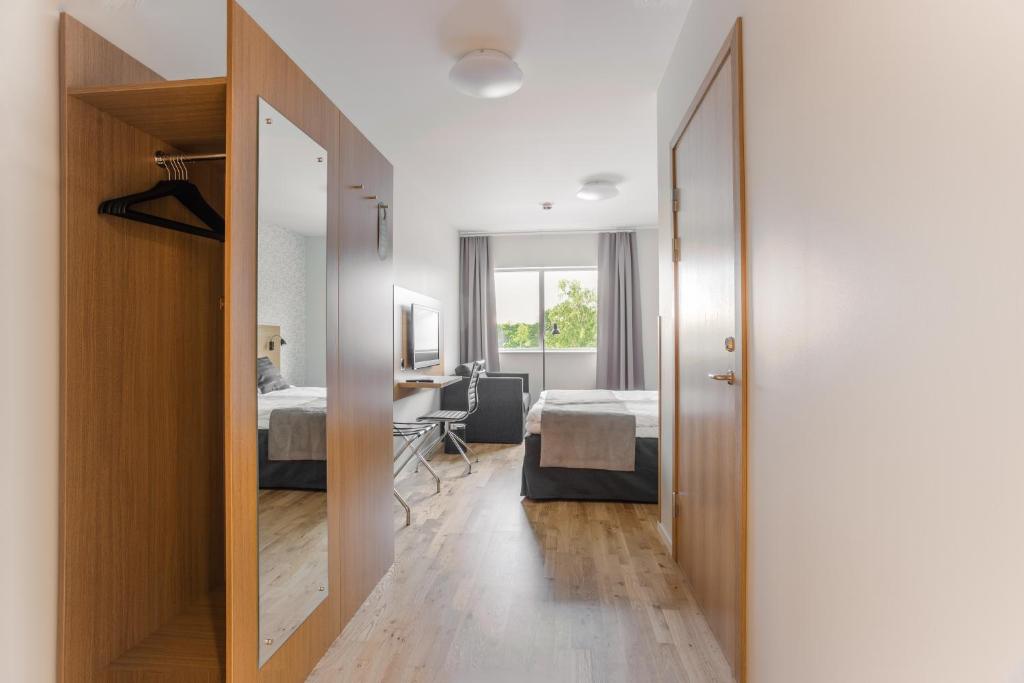 Postel nebo postele na pokoji v ubytování Hotel Spekeröd