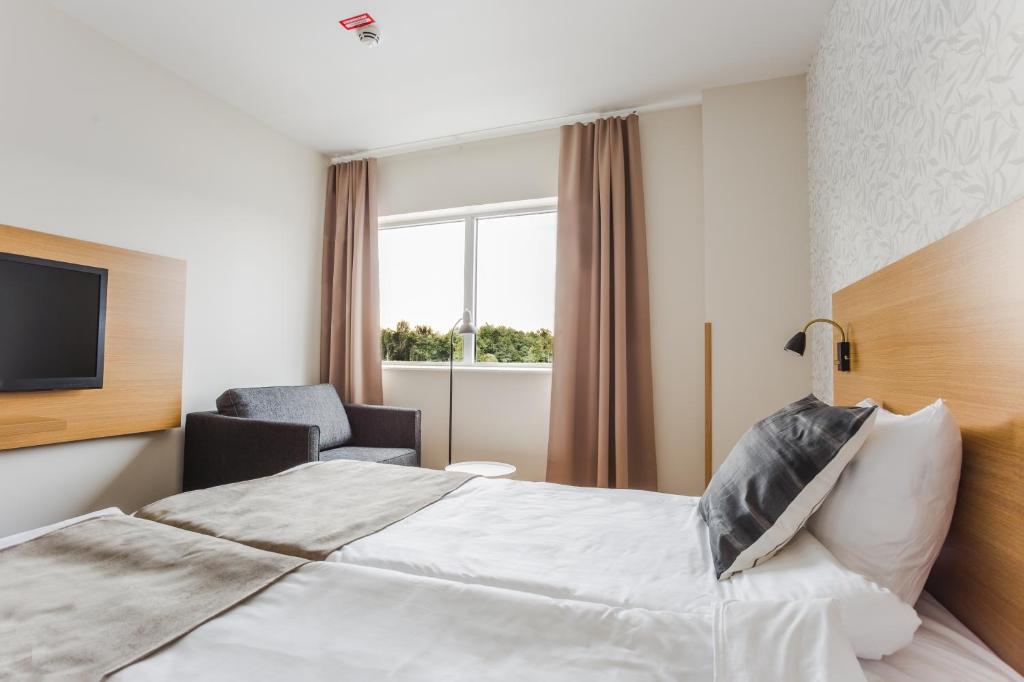Postel nebo postele na pokoji v ubytování Hotel Spekeröd