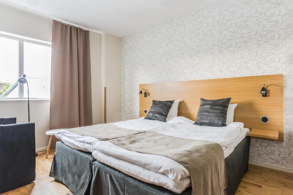 Postel nebo postele na pokoji v ubytování Hotel Spekeröd