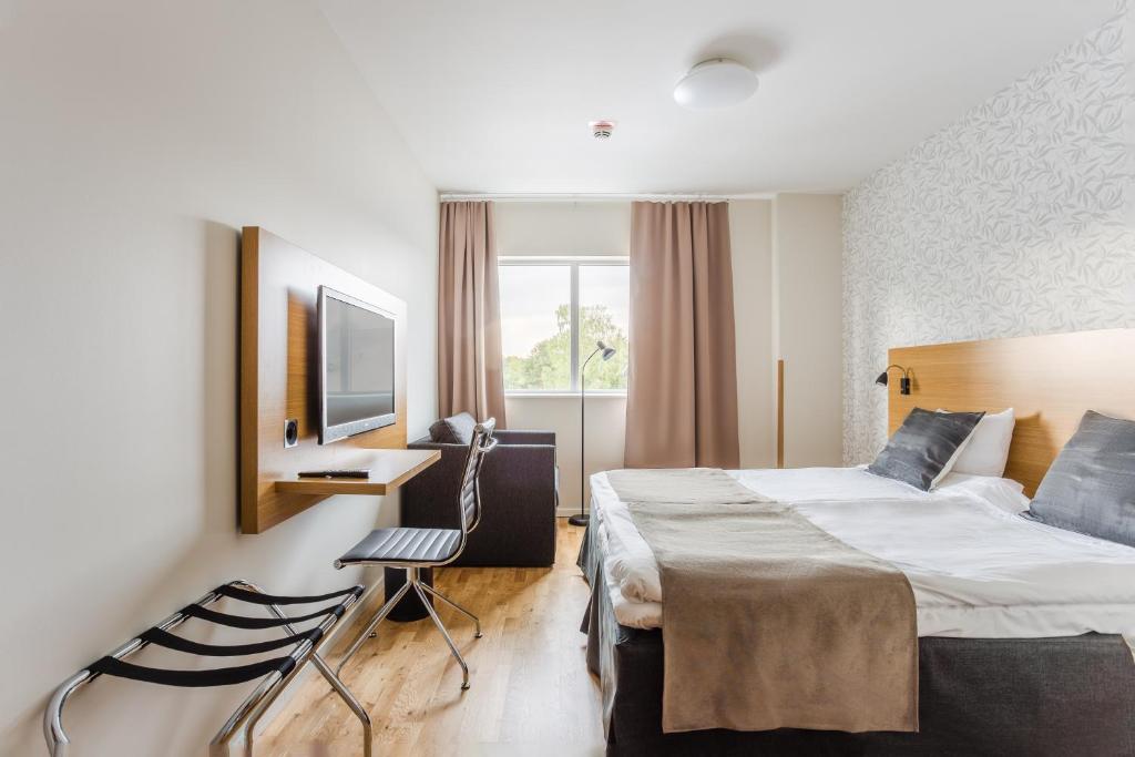 Postel nebo postele na pokoji v ubytování Hotel Spekeröd
