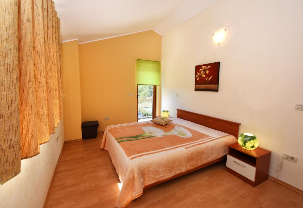 Postel nebo postele na pokoji v ubytování Villa Kmacici 377