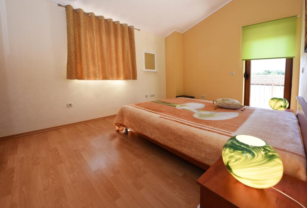 Postel nebo postele na pokoji v ubytování Villa Kmacici 377