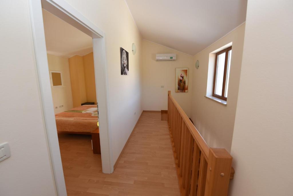 Postel nebo postele na pokoji v ubytování Villa Kmacici 377