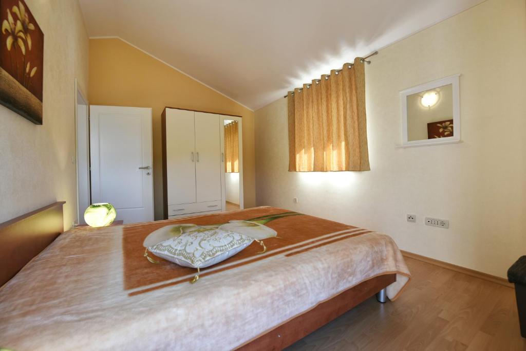 Postel nebo postele na pokoji v ubytování Villa Kmacici 377