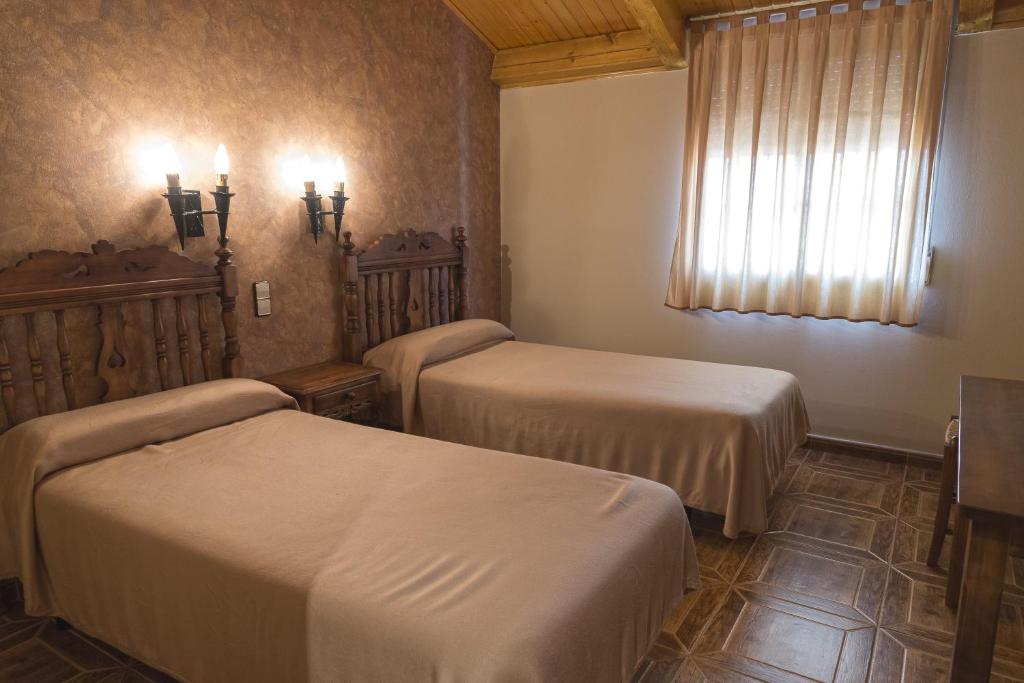 Posteľ alebo postele v izbe v ubytovaní Hotel-Restaurante La Sima