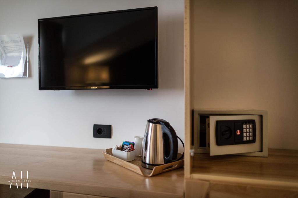 TV a/nebo společenská místnost v ubytování GARNI HOTEL ATRIUM
