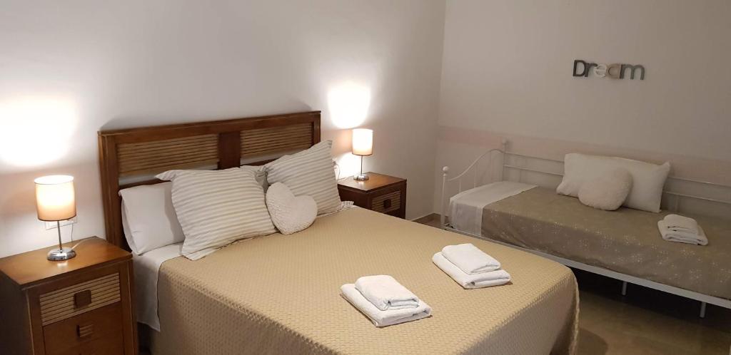 En eller flere senge i et værelse på Dúplex Palacio del Vizconde