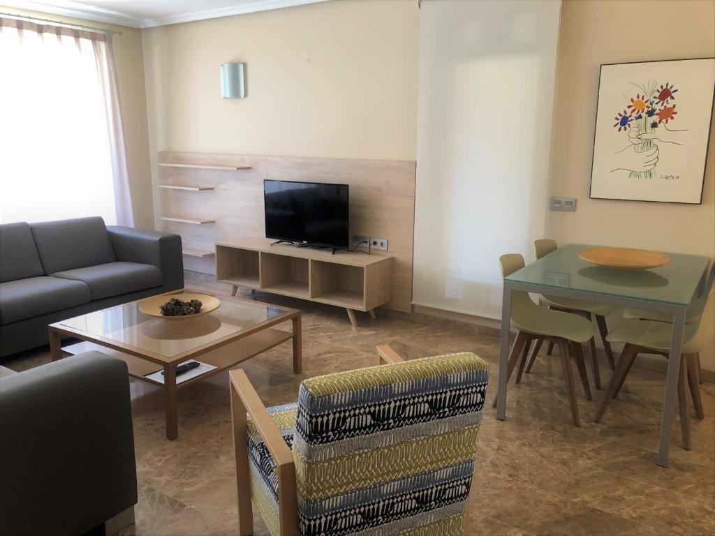 TV a/nebo společenská místnost v ubytování Apartamentos Plaza Picasso