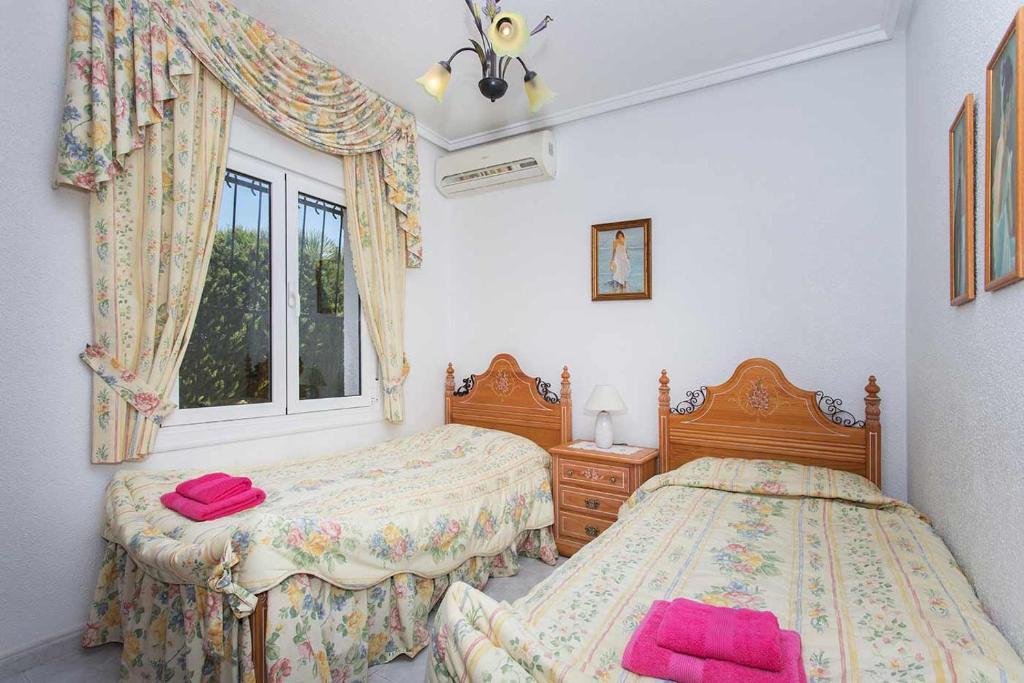 Postel nebo postele na pokoji v ubytování CH Villa Murillo Ciudad Quesada