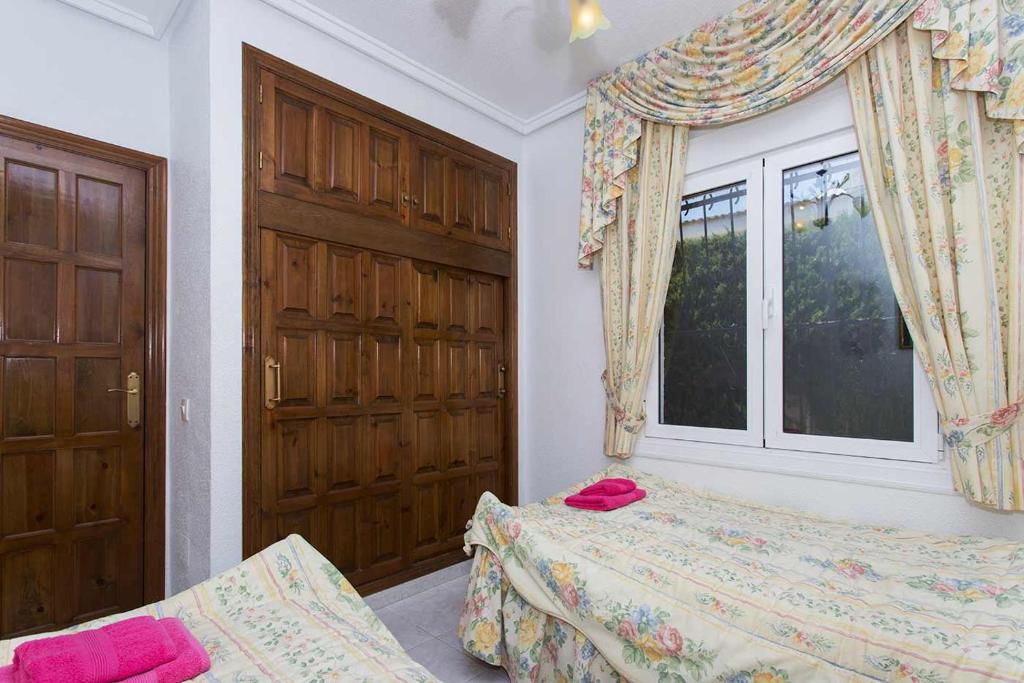 Postel nebo postele na pokoji v ubytování CH Villa Murillo Ciudad Quesada