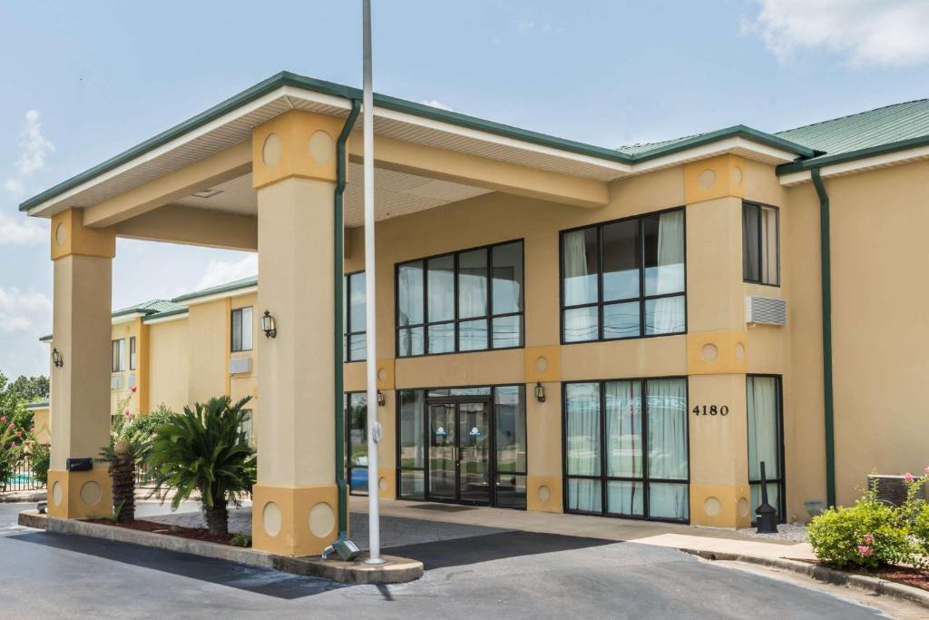 a large office building with a lot of windows at Days Inn by Wyndham Montgomery in Montgomery