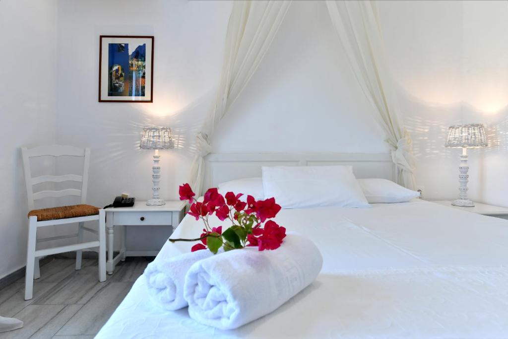 Postel nebo postele na pokoji v ubytování Hotel Swiss Home