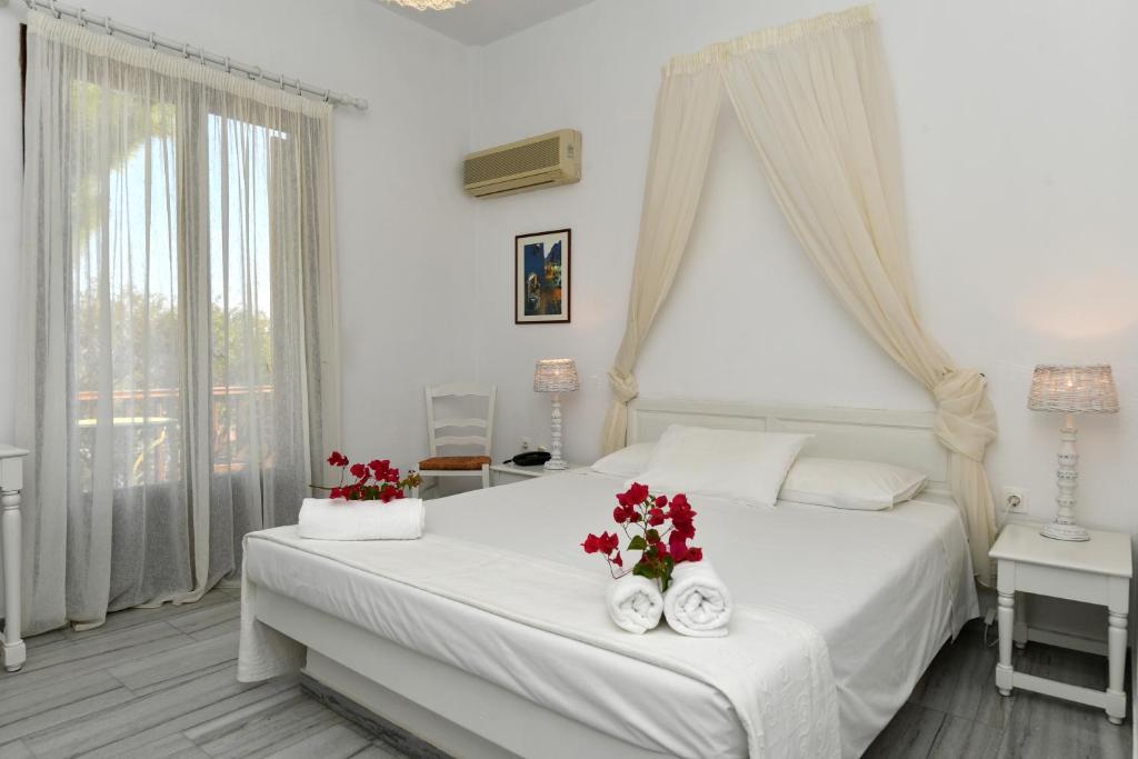 Postel nebo postele na pokoji v ubytování Hotel Swiss Home