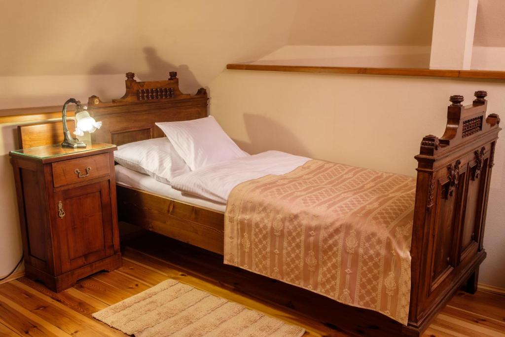 A bed or beds in a room at Boutique hotel Pracháreň