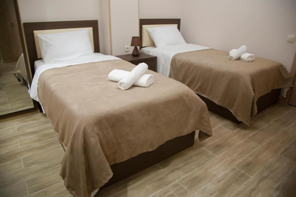 Postel nebo postele na pokoji v ubytování Family Hotel Triston