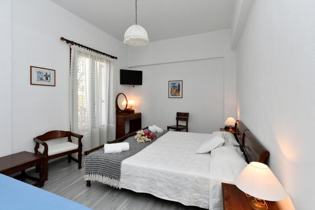 Postel nebo postele na pokoji v ubytování Hotel Swiss Home