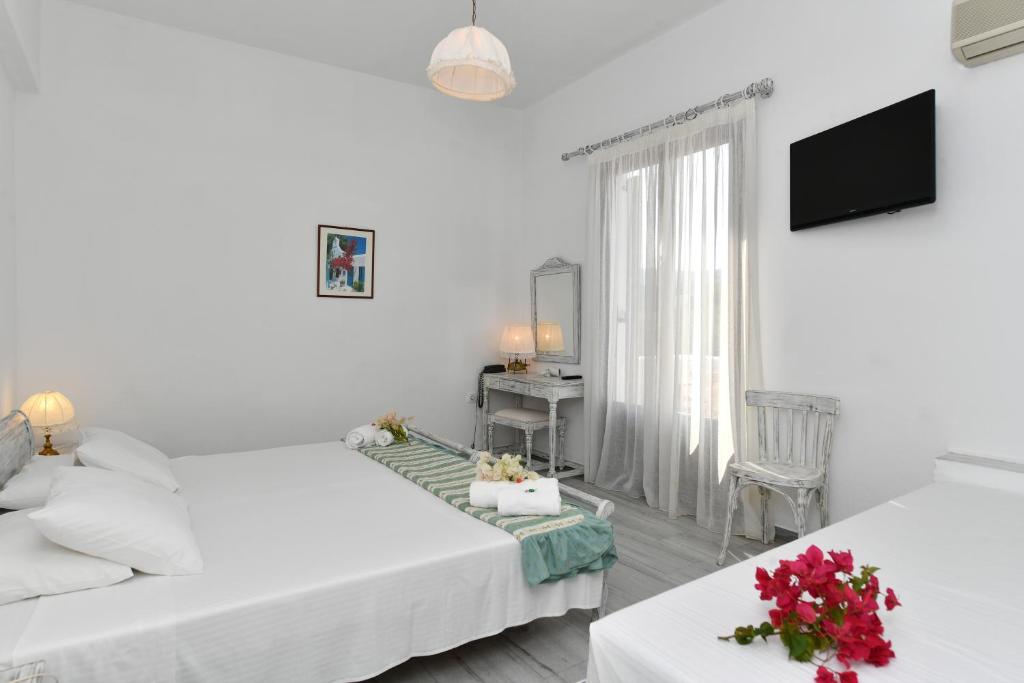 Postel nebo postele na pokoji v ubytování Hotel Swiss Home