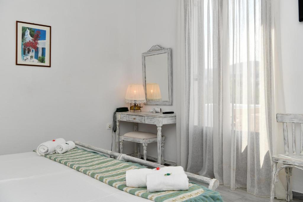 Postel nebo postele na pokoji v ubytování Hotel Swiss Home