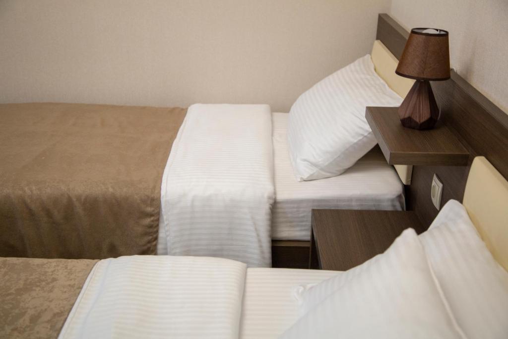 Postel nebo postele na pokoji v ubytování Family Hotel Triston