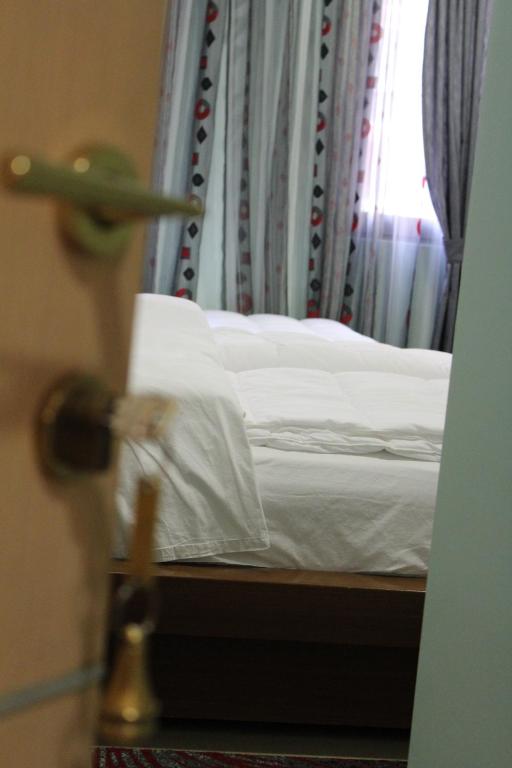 Postel nebo postele na pokoji v ubytování Hotel Piemonte
