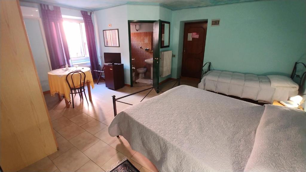 Postel nebo postele na pokoji v ubytování Hotel Centrale