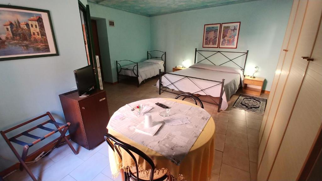 Postel nebo postele na pokoji v ubytování Hotel Centrale