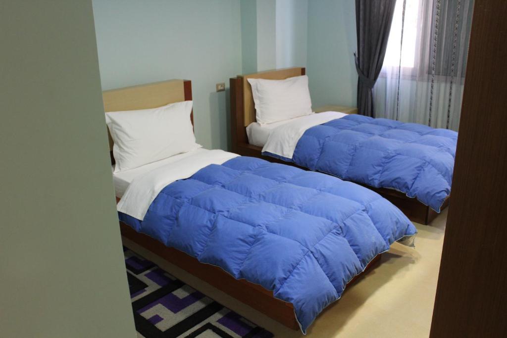 Postel nebo postele na pokoji v ubytování Hotel Piemonte