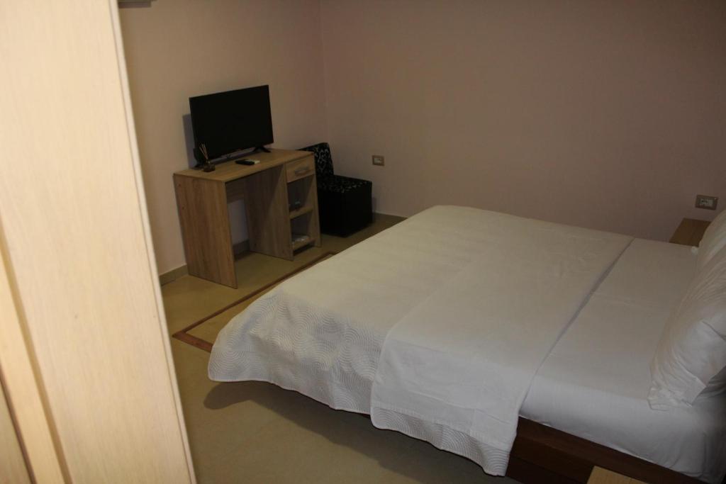 Postel nebo postele na pokoji v ubytování Hotel Piemonte