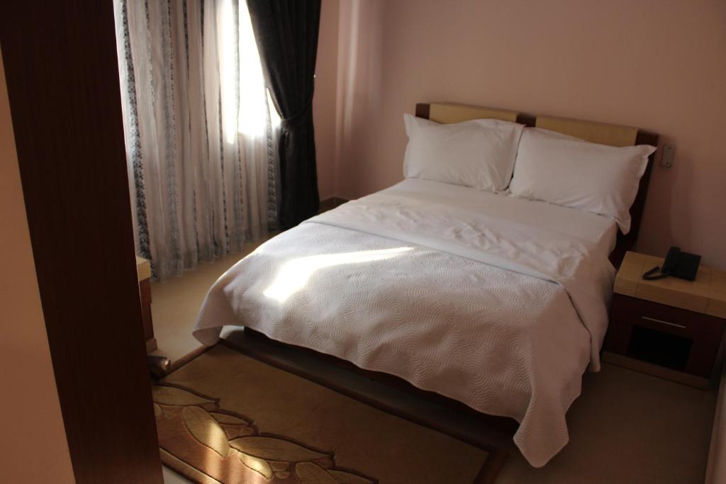 Postel nebo postele na pokoji v ubytování Hotel Piemonte