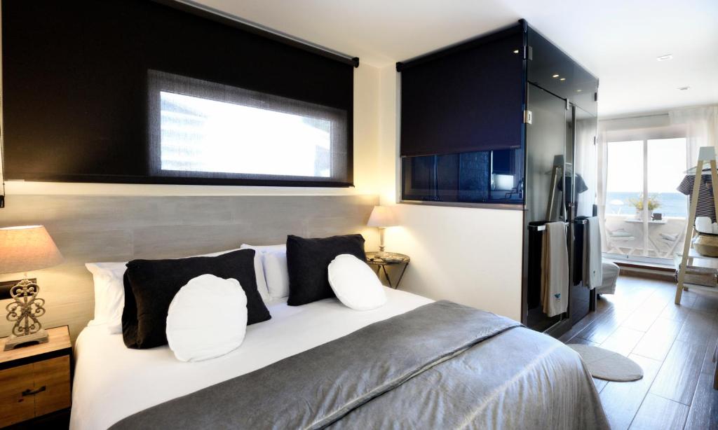 Posteľ alebo postele v izbe v ubytovaní Hotel Sa Tuna