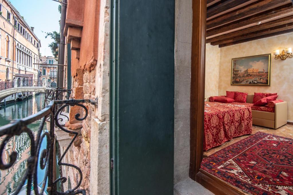 Postel nebo postele na pokoji v ubytování Hotel Mercurio