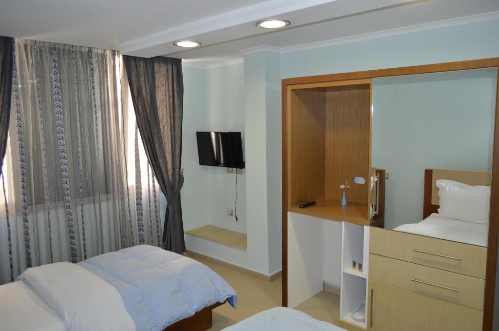 Postel nebo postele na pokoji v ubytování Hotel Piemonte